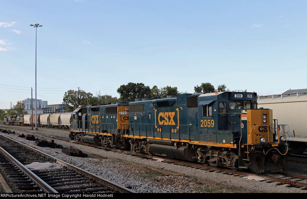 CSX 2059 & 2791 sit idle as train F741 gets built in the background